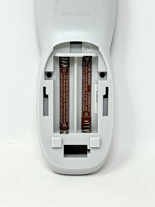 The back of a white electronic device, showing the battery compartment open with two batteries inserted. The device has 'Made in China' printed on it, and the batteries are brown with white text.