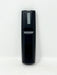 A black plastic remote control standing vertically against a plain white background.