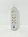 A white GE remote control with gold and black buttons, photographed against a plain off-white background.