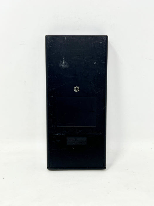 A black plastic rectangular wall switch or electrical panel with a small circular dial in the center, shown against a plain white background.