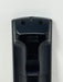 Close-up of the back of a black plastic remote control showing molded serial numbers 'N2QAYB 000486' on a white background.