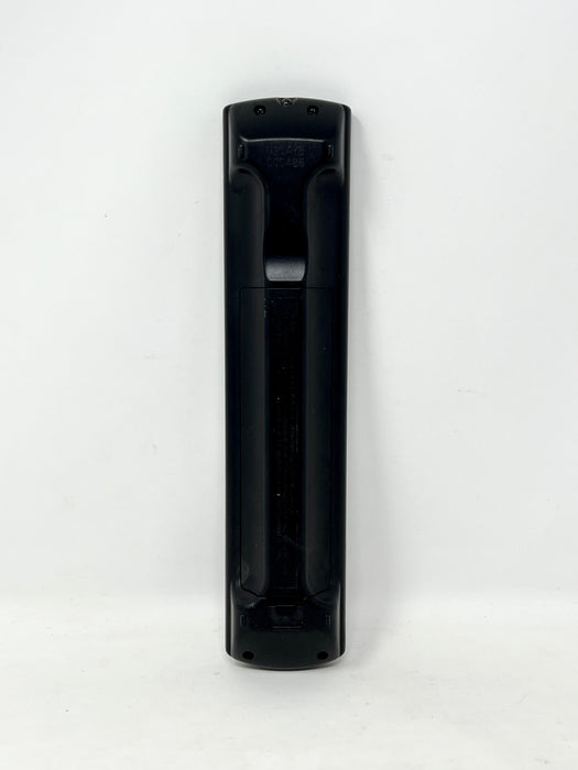 A black plastic remote control standing vertically against a plain white background.