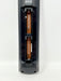 A close-up of a black cylindrical electronic device with its battery compartment open, showing two copper-colored batteries inserted vertically against a plain white background.