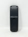The back of a grey plastic remote control with a battery compartment cover, photographed against a plain white background.