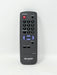 A black Sharp TV remote control with a red power button, blue navigation buttons, and white printed labels on a plain white background.