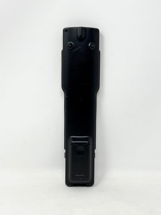 A black plastic remote control standing vertically against a plain white background.