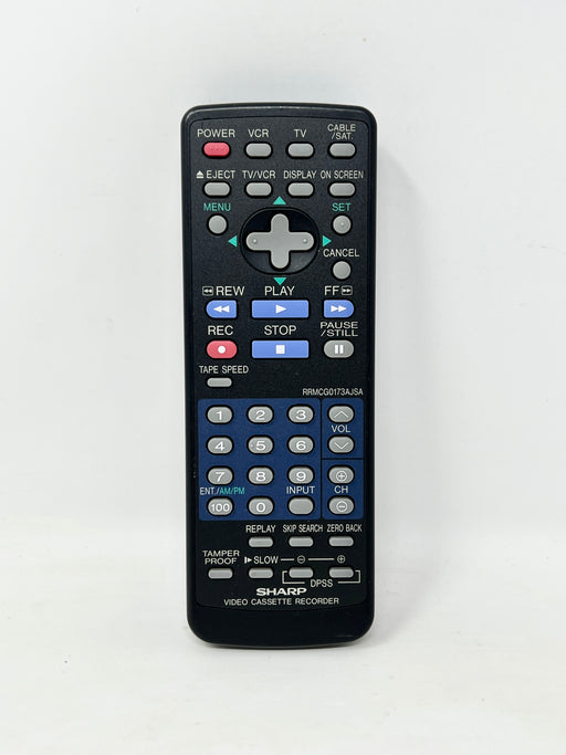 A black Sharp OPSS video cassette recorder remote control with blue, red, and white buttons, photographed against a plain white background.