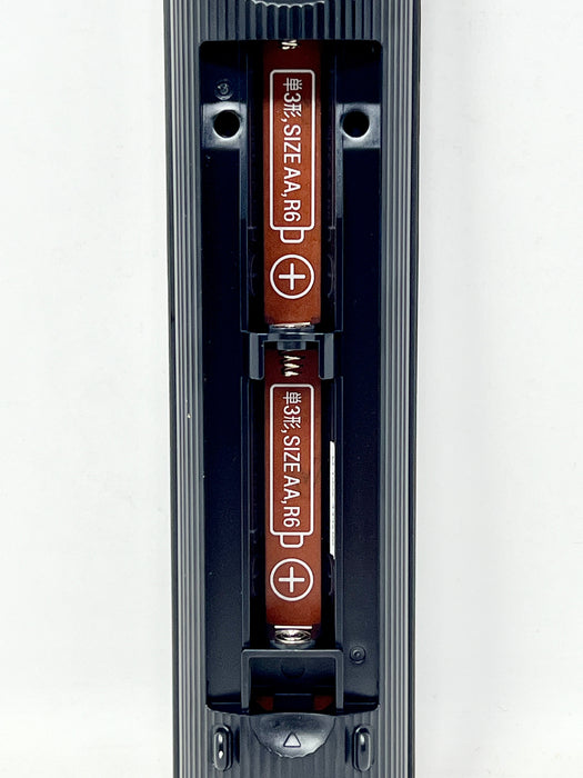 Two AA batteries in a dual-cell battery compartment of a black device, shown against a plain white background.