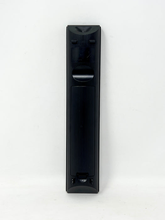 A tall, narrow black electronic device with ribbed sides and a circular dial, photographed upright against a plain white background.