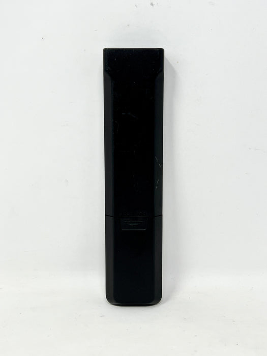 A black rectangular remote control standing vertically against a plain white background.