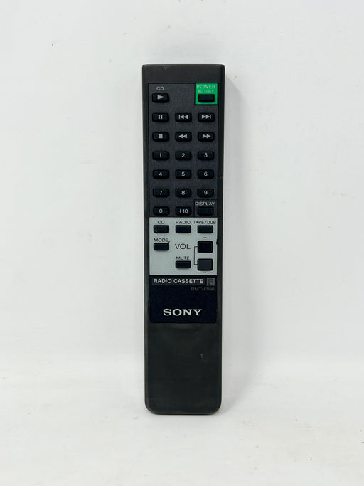 A black Sony Radio Cassette remote control standing upright against a plain white background.