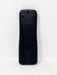 The back of a black plastic remote control standing vertically against a plain white background.
